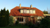 House before tile cleaning. The unsightly discolouration on the roof is caused by Gleocapsa Magma bacteria.